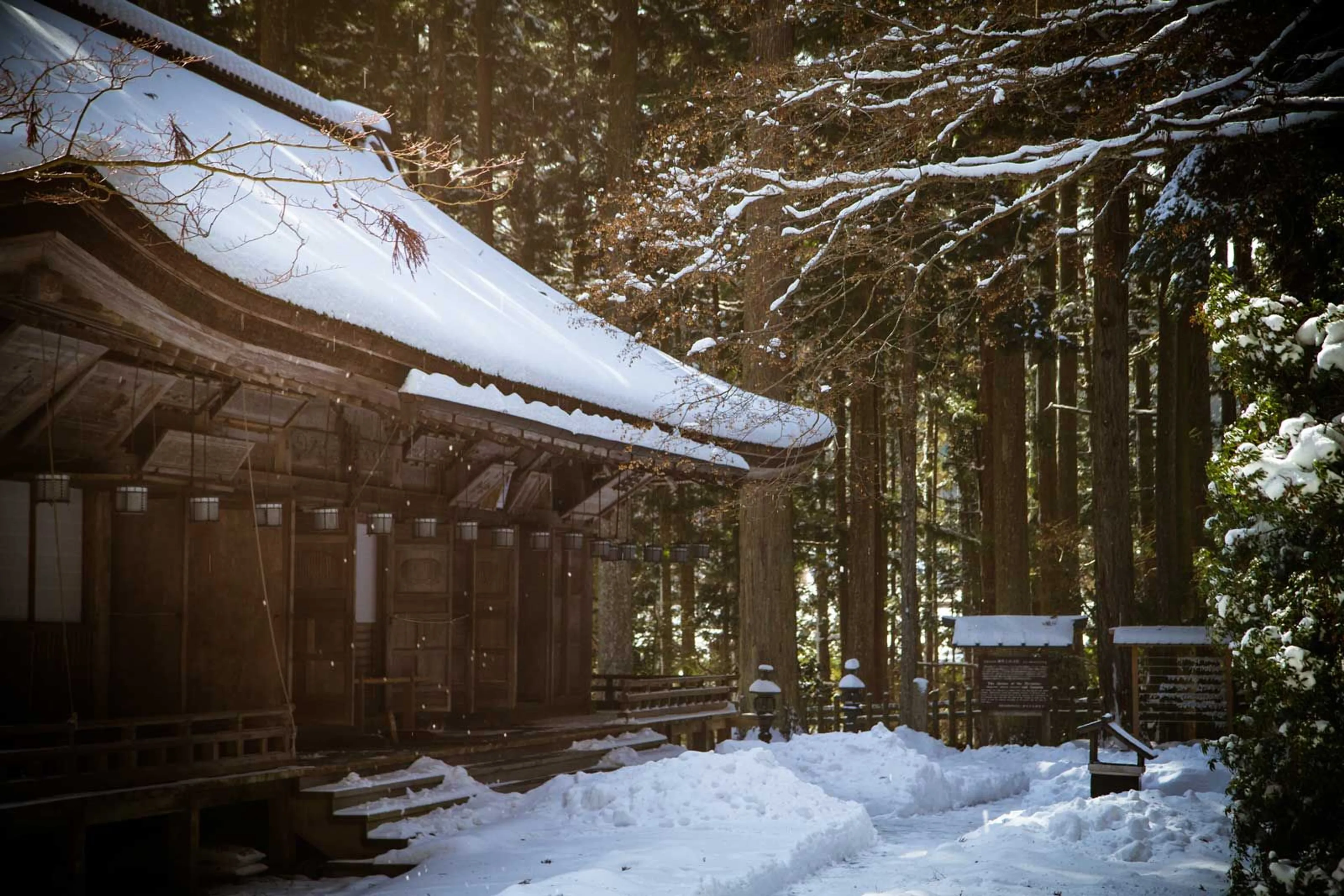 Snow falls from the rooftop of a temple in the Kongobu-ji complex in Koyasan.