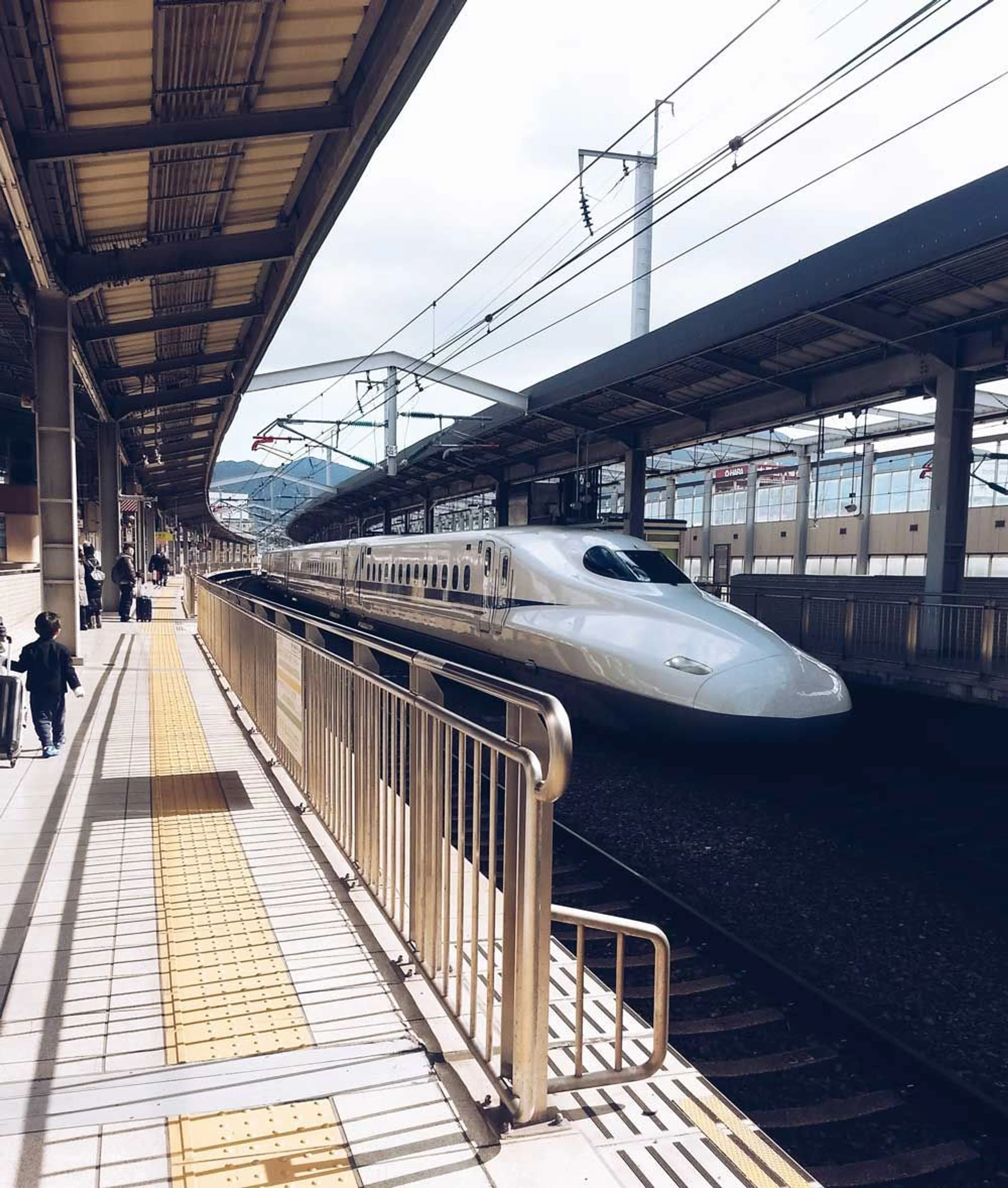 The shinkansen approaches a station in western Honshu/eastern Kyushu