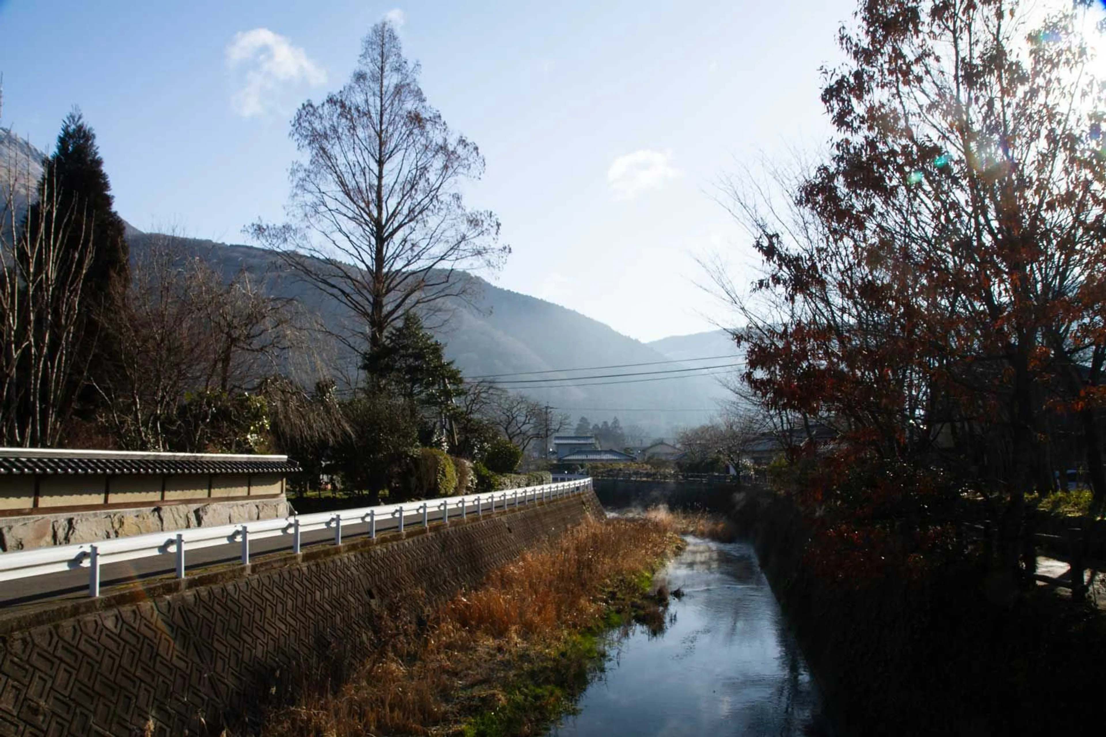 A river runs through the Eastern side of Yufuin.